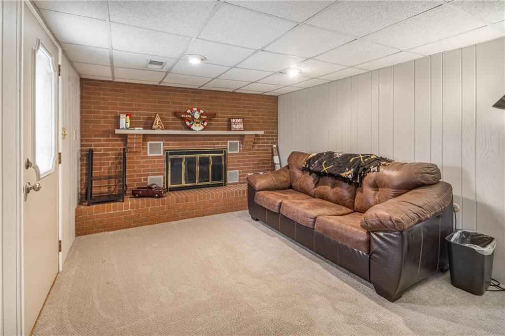 7 Josephine Street Slovan, PA 15078 - Photo 20 of 26 a living room with furniture and a fireplace