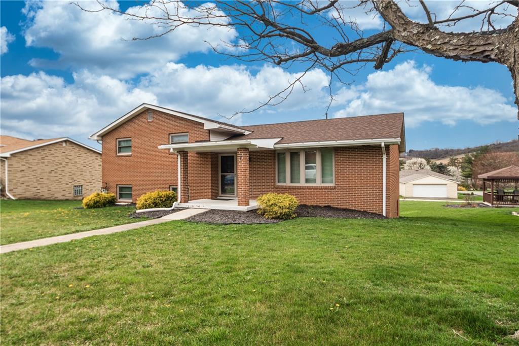 7 Josephine Street Slovan, PA 15078 - Photo 26 of 26 a front view of a house with a garden and yard