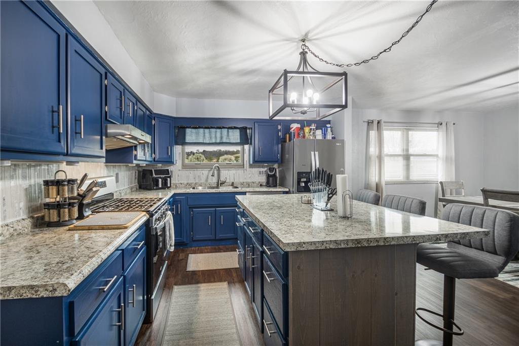 7 Josephine Street Slovan, PA 15078 - Photo 3 of 26 a kitchen with granite countertop lots of counter top space and appliances