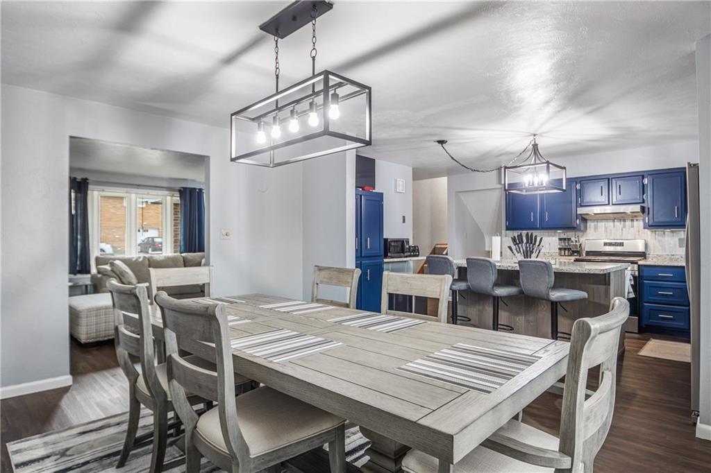 7 Josephine Street Slovan, PA 15078 - Photo 7 of 26 a view of a dining room with furniture a chandelier and wooden floor