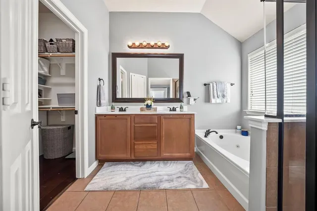a bedroom with a bed and glass window
