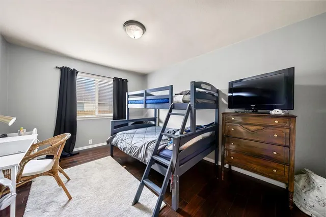 a bathroom with a granite countertop sink mirror and shower