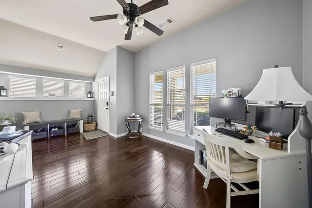 a view of room with wooden floor