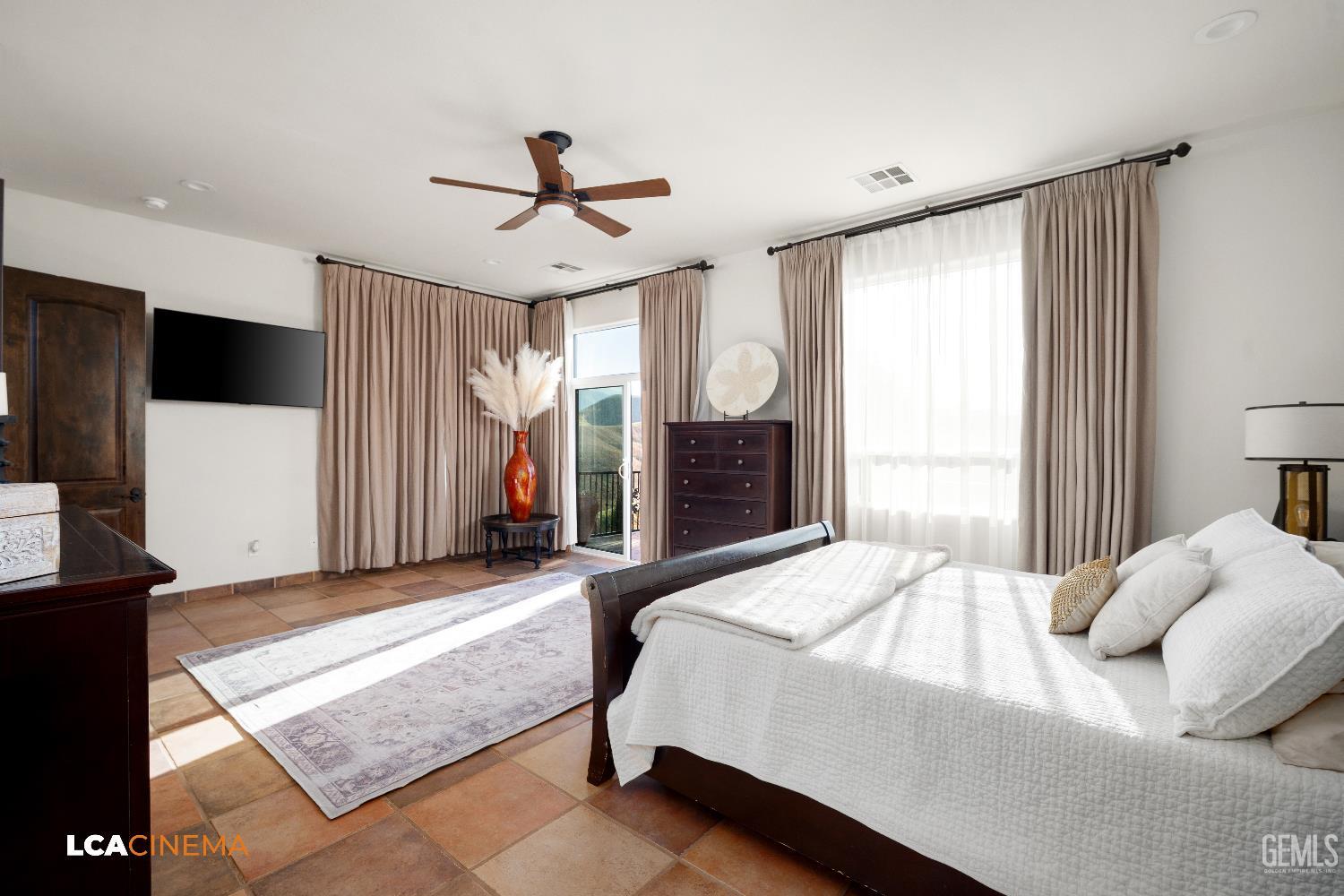 Undisclosed Address Bakersfield, CA 93306 - Photo 14 of 56 a bedroom with a bed and a flat screen tv