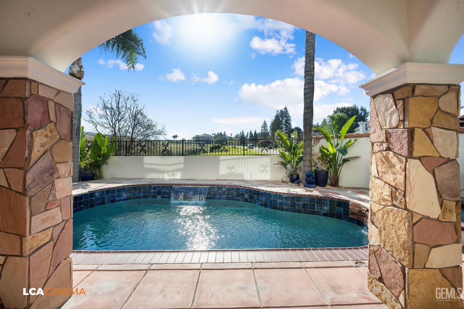 Undisclosed Address Bakersfield, CA 93306 - Photo 39 of 56 a view of a swimming pool with a yard