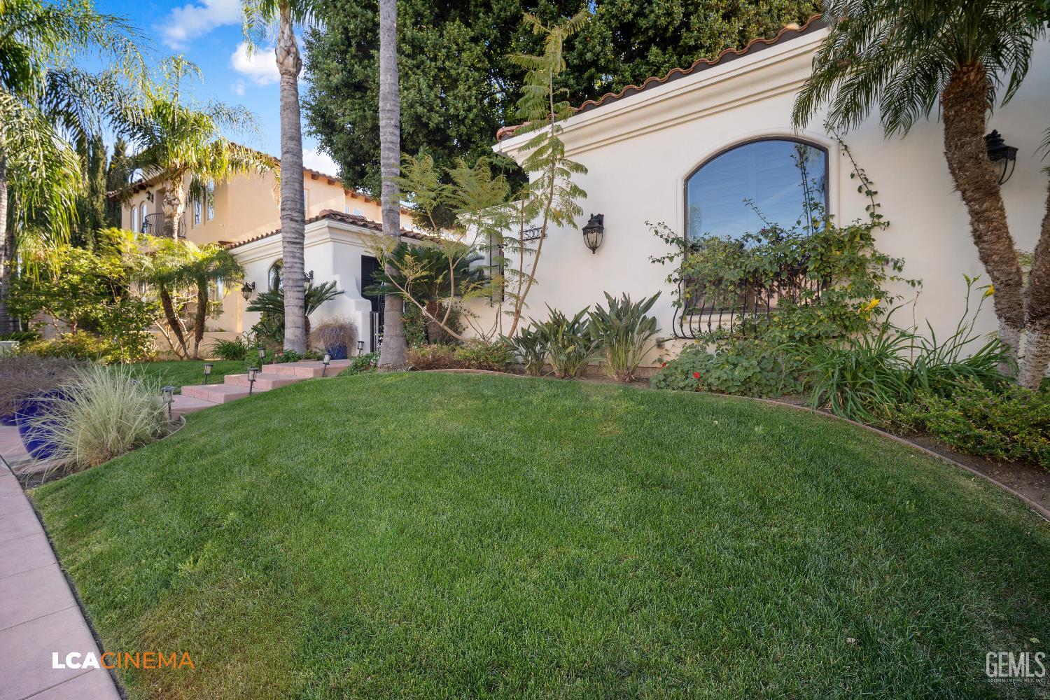 Undisclosed Address Bakersfield, CA 93306 - Photo 4 of 56 a view of backyard with potted plants and a large tree