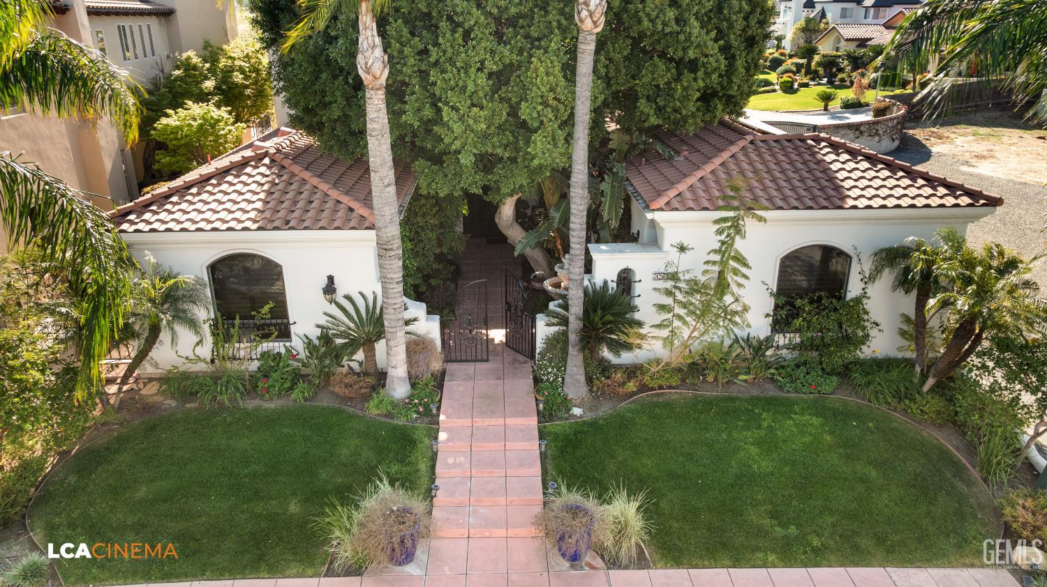Undisclosed Address Bakersfield, CA 93306 - Photo 8 of 56 a front view of a house with garden