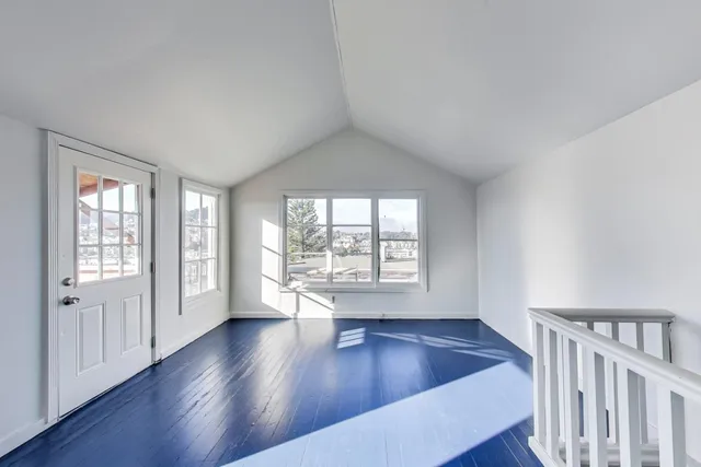 a view of hallway with windows