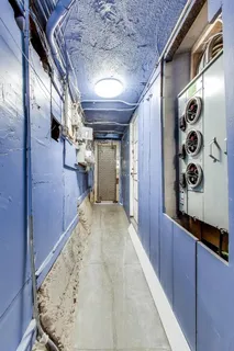 a white toilet sitting next to a bathroom sink