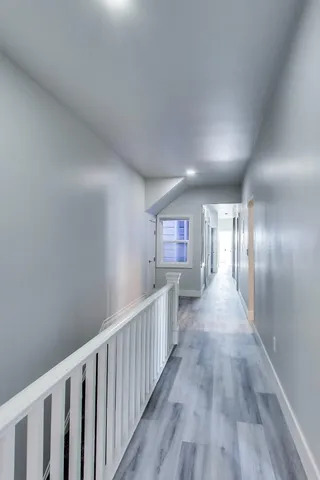 a bedroom with a bed and a table in it