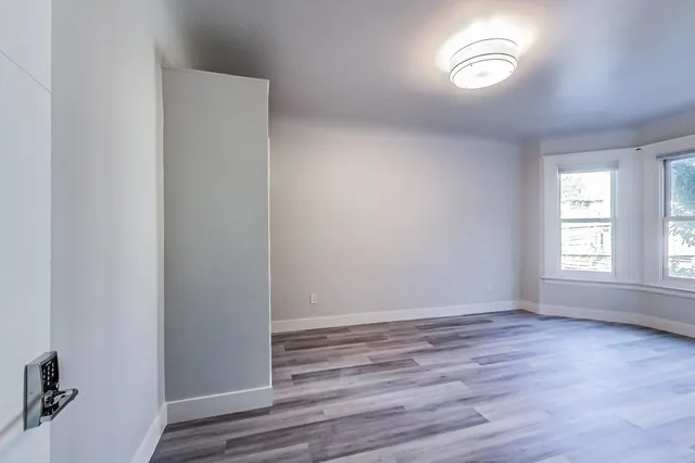 a view of an outdoor sitting area with brick walls