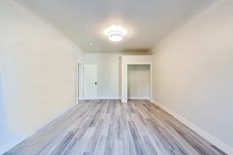 a view of an outdoor sitting area with brick walls