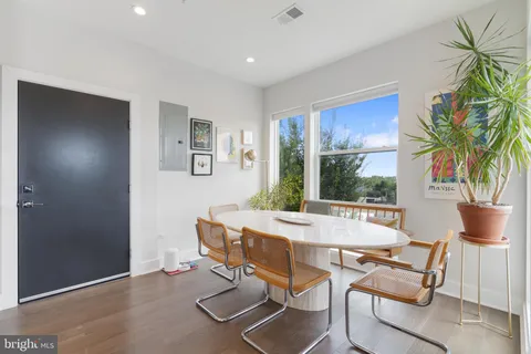 a view of a dining room with furniture window and outside view