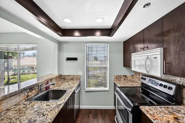 a kitchen with a stove and a sink