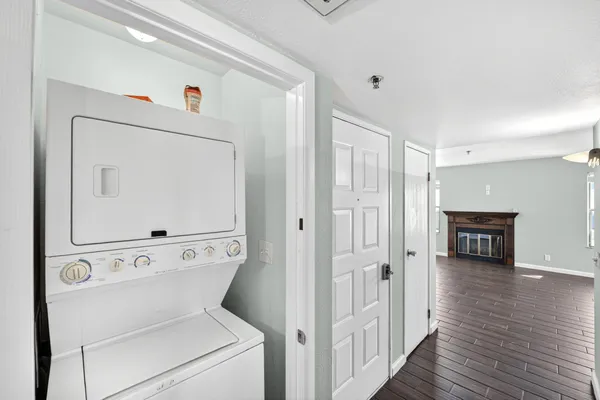 a view of washer and dryer with wooden floor