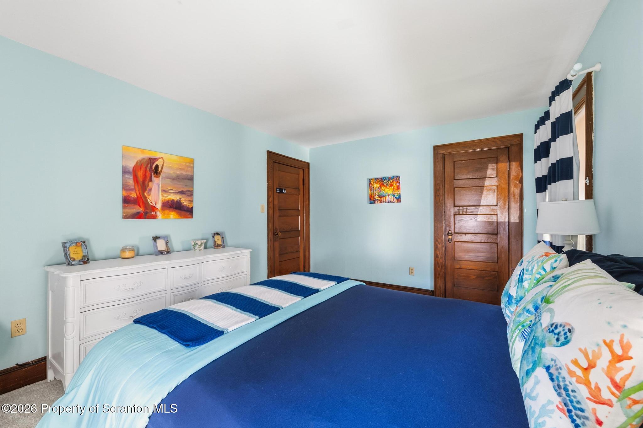 616 Myrtle Street Scranton, PA 18510 - Photo 35 of 65 a bedroom with a bed and a dresser in it