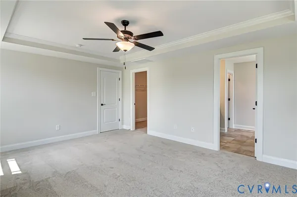 a bathroom with a granite countertop sink a light fixture and a mirror
