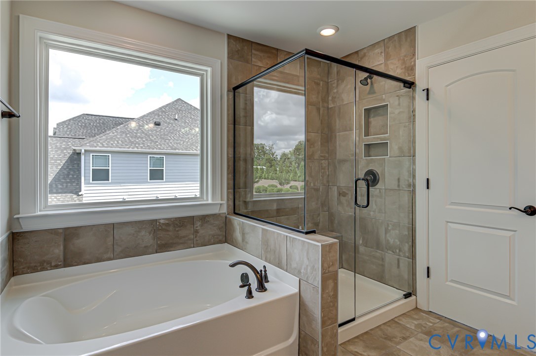 11366 Pinewild Drive Providence Forge, VA 23140 - Photo 13 of 22 a bathroom with a bathtub and a shower