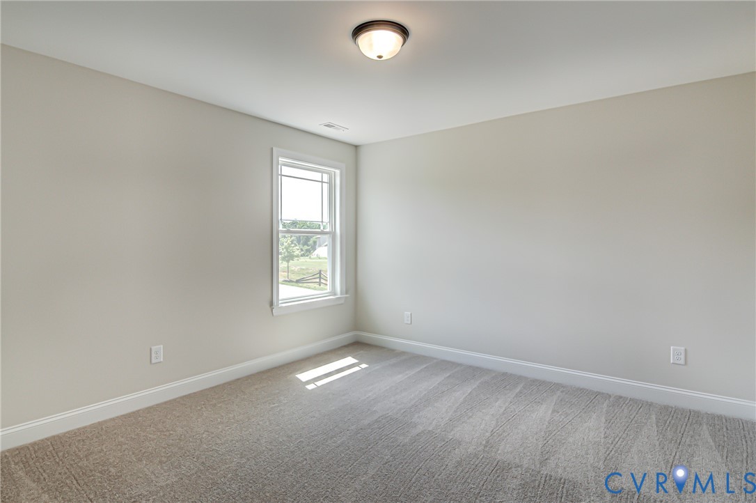 11366 Pinewild Drive Providence Forge, VA 23140 - Photo 14 of 22 an empty room with a empty space and a window