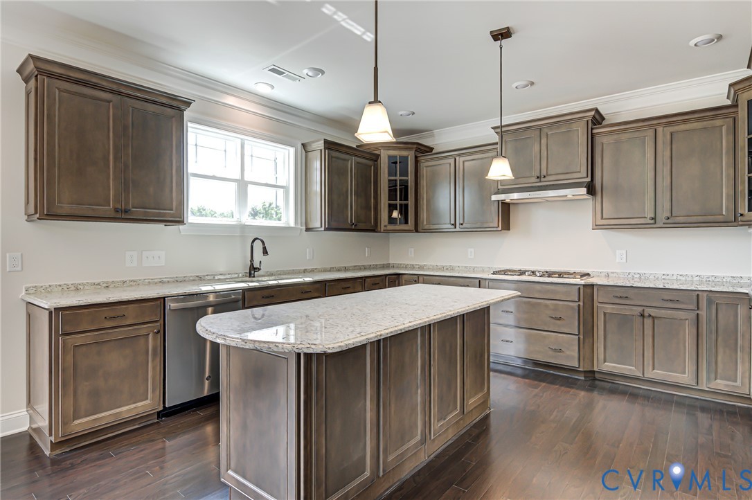 11366 Pinewild Drive Providence Forge, VA 23140 - Photo 2 of 22 a kitchen with stainless steel appliances granite countertop a sink a stove a refrigerator and island with wooden floor