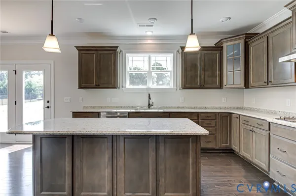 a kitchen with a sink cabinets and window