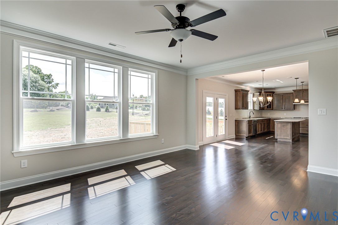 11366 Pinewild Drive Providence Forge, VA 23140 - Photo 6 of 22 a view of an empty room with wooden floor and a window