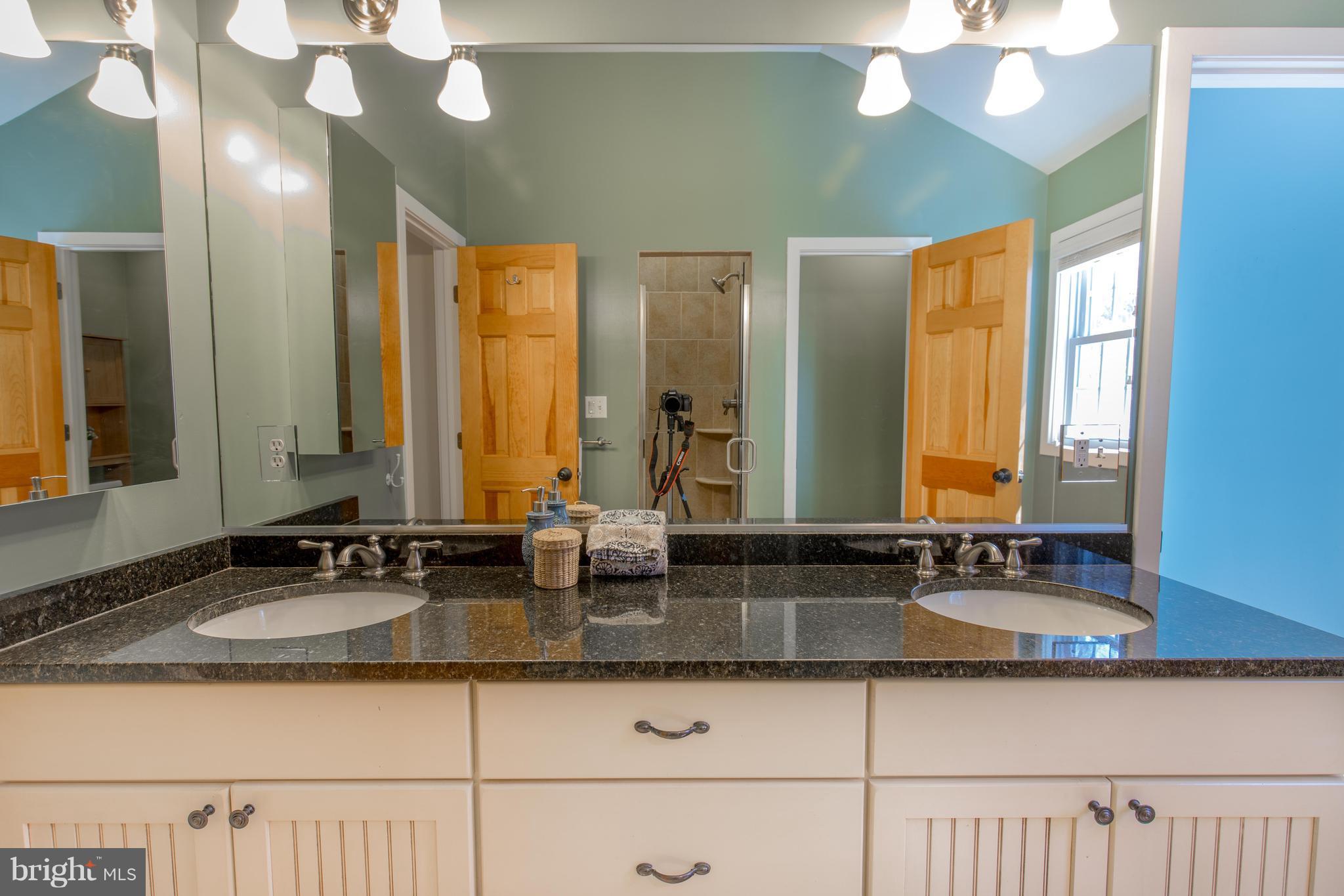 309 Willington Drive Silver Spring, MD 20904 - Photo 17 of 30 a bathroom with a sink and a mirror
