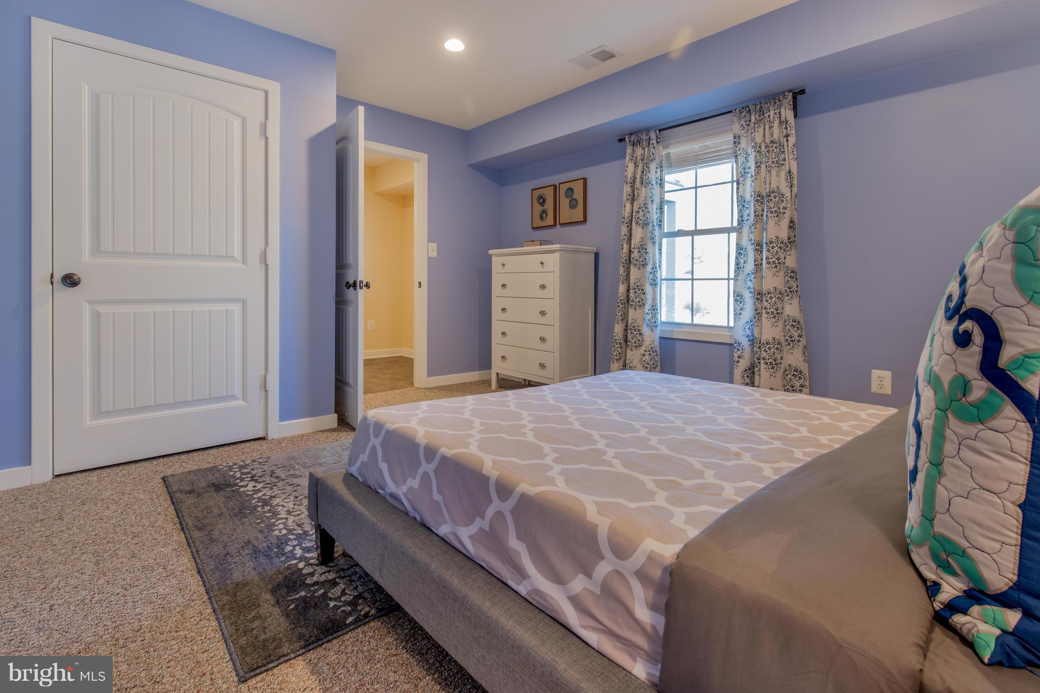 309 Willington Drive Silver Spring, MD 20904 - Photo 29 of 30 a bedroom with a bed and a window