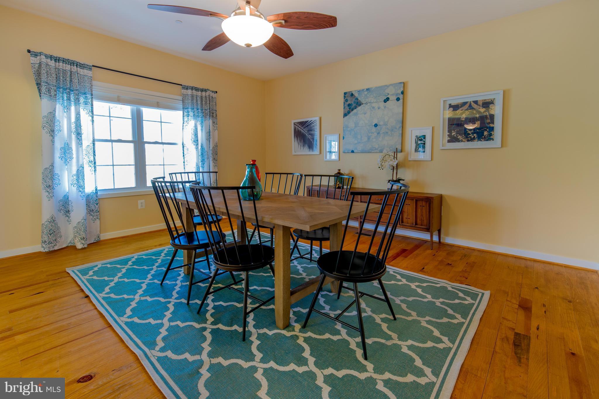 309 Willington Drive Silver Spring, MD 20904 - Photo 5 of 30 a view of a dining room with furniture and wooden floor