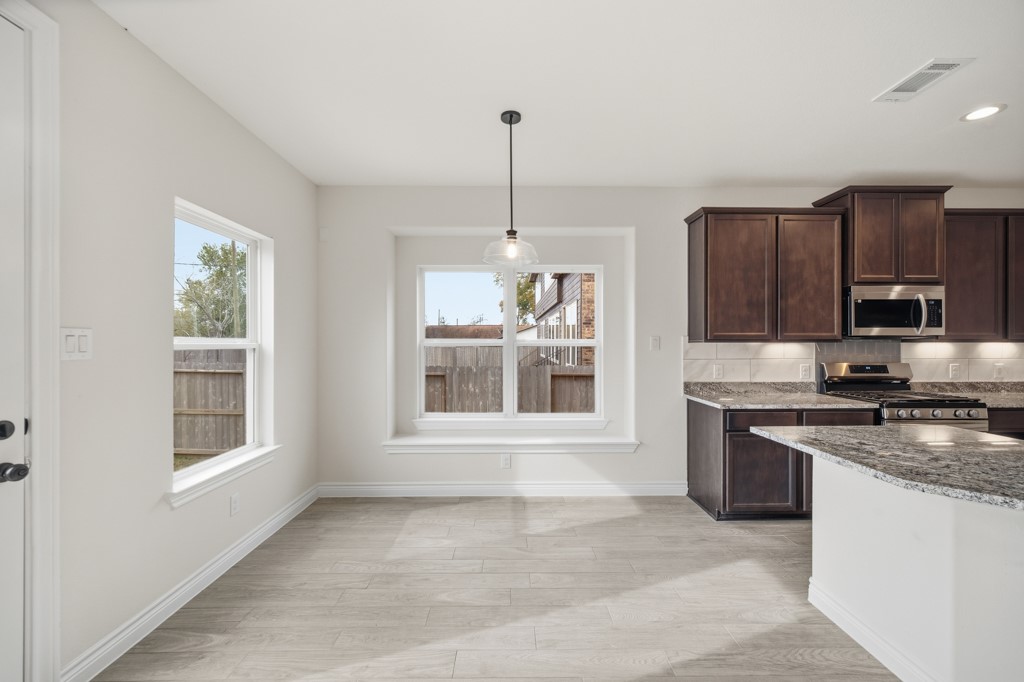 16507 Boston Post Road Cypress, TX 77429 - Photo 11 of 39 The bright and airy breakfast room opens seamlessly to the kitchen.