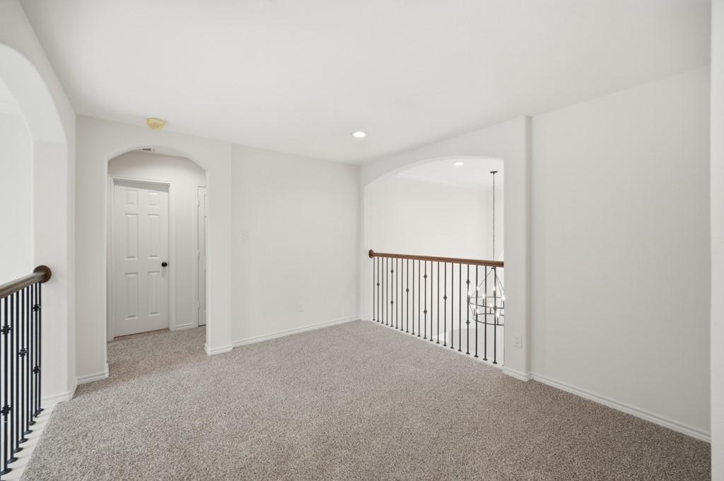 16507 Boston Post Road Cypress, TX 77429 - Photo 22 of 39 A view of the hallway that leads to the additional bedrooms and shared bathroom.