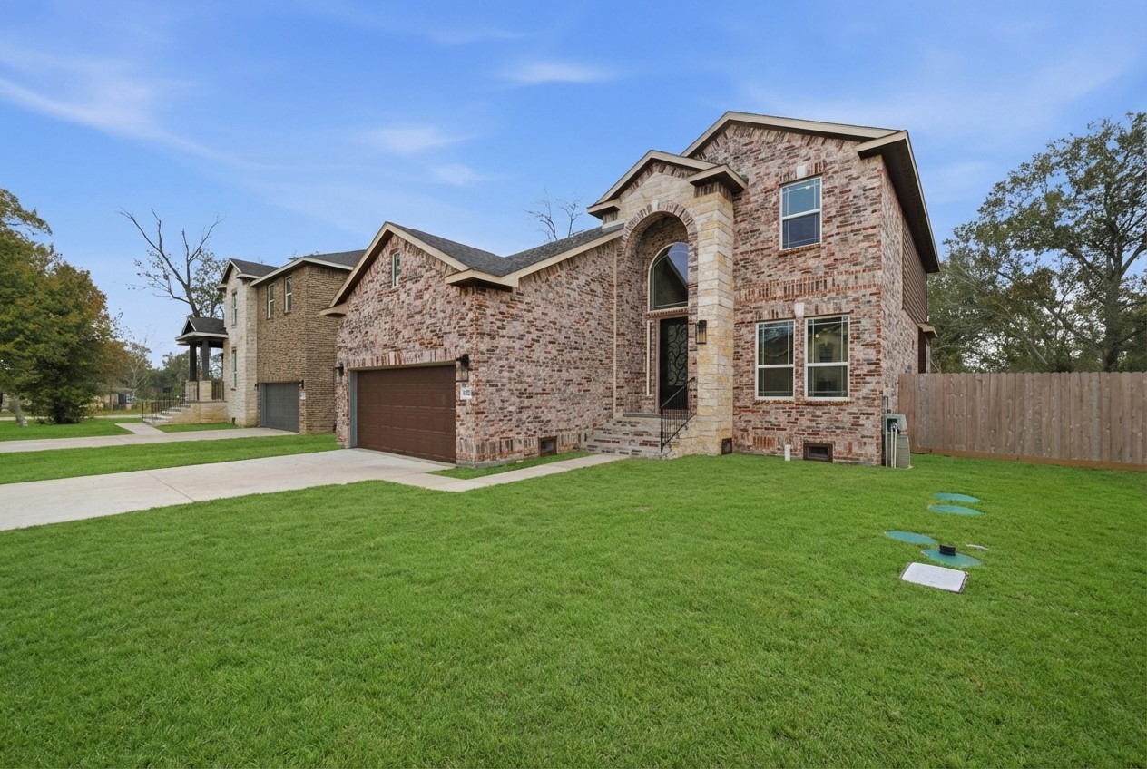 16507 Boston Post Road Cypress, TX 77429 - Photo 38 of 39 The home’s brick and stone exterior is enhanced by a spacious, inviting front yard, complete with a charming walking path leading to the front porch.