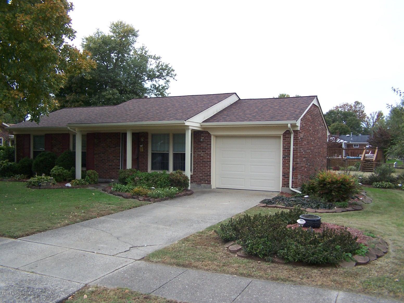 11004 Torrington Road Louisville, KY 40272 - Photo 5 of 43 Front view of this all brick 3 Bedroom home with 1 updated Full Bath, Living Room, added Family Room on the back, Eat-In Area in Kitchen, Laundry Room, 1 Car Attached Garage, Covered Front Porch, Replacement Windows, ALL new Carpeting, New Paint, Fully Fenced Back Yard, Utility Shed and an above ground pool with a tanning deck.