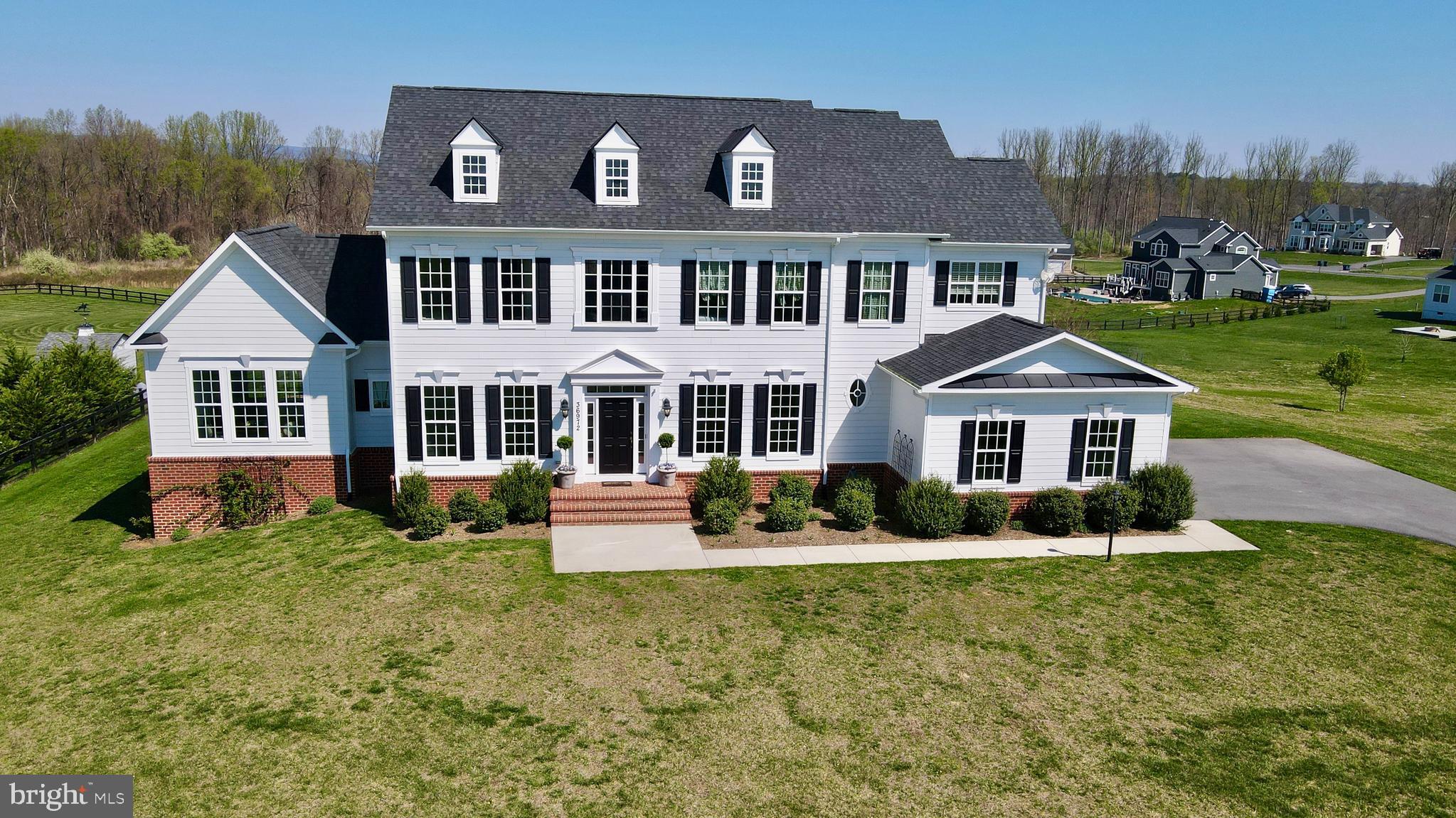 36972 Bridle Ridge Lane Purcellville, VA 20132 - Photo 1 of 44 a front view of a house with garden
