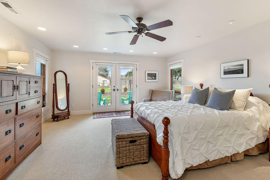 3828 Upper Applegate Road Jacksonville, OR 97530 - Photo 6 of 69 a bed room with a bed and a dresser