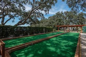 11241 Dollar Lake Drive, Unit 5 Port Richey, FL 34668 - Photo 48 of 49 a view of a house with backyard and a garden