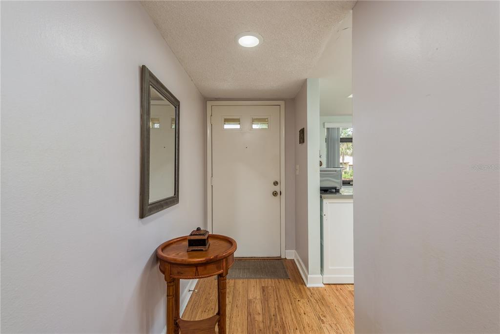 11241 Dollar Lake Drive, Unit 5 Port Richey, FL 34668 - Photo 5 of 49 a bathroom with a sink and a mirror