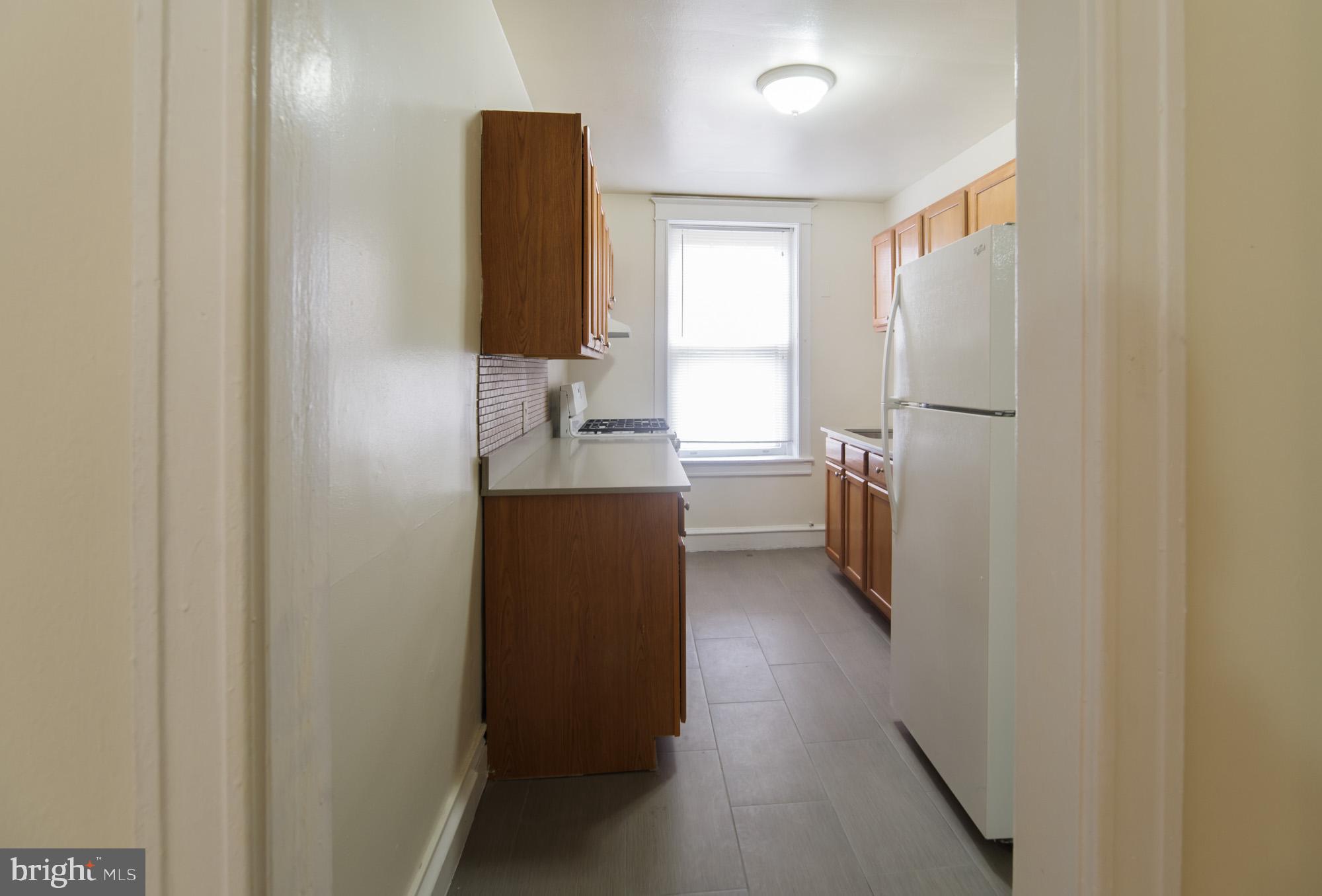 6640 Sprague Street, Unit A302 Philadelphia, PA 19119 - Photo 11 of 13 a bathroom with a sink and mirror