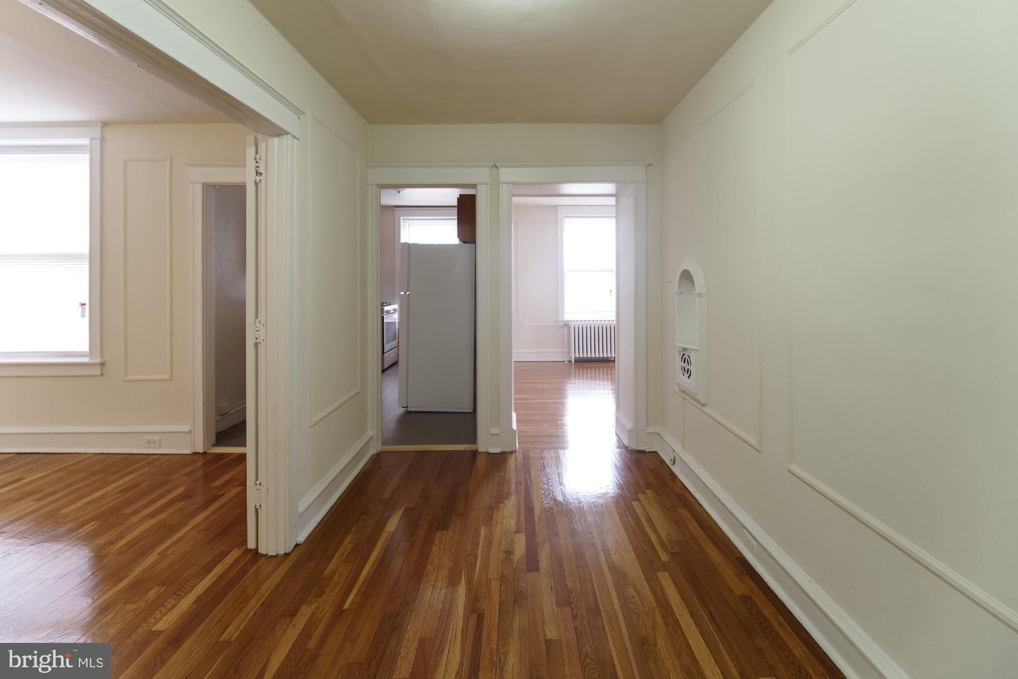6640 Sprague Street, Unit A302 Philadelphia, PA 19119 - Photo 2 of 13 a view of hallway with wooden floor