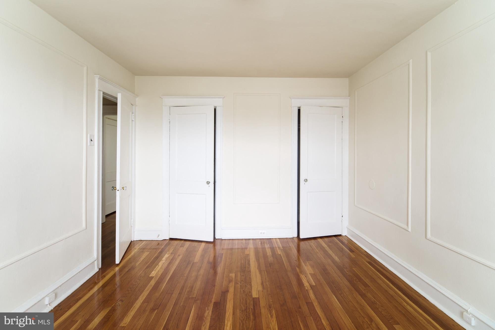 6640 Sprague Street, Unit A302 Philadelphia, PA 19119 - Photo 4 of 13 a view of an empty room with wooden floor