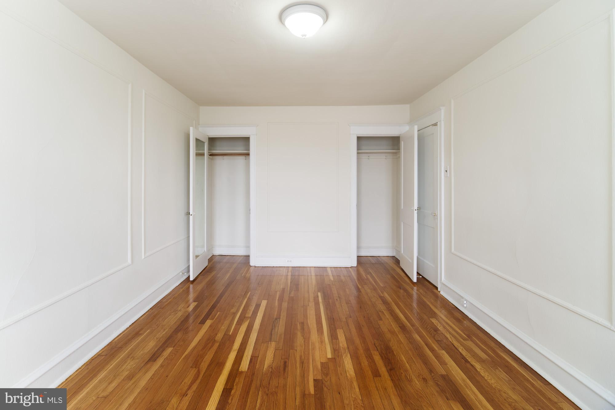 6640 Sprague Street, Unit A302 Philadelphia, PA 19119 - Photo 6 of 13 a view of wooden floor in a room