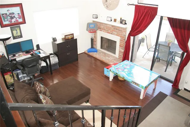 a living room with furniture fireplace and flat screen tv