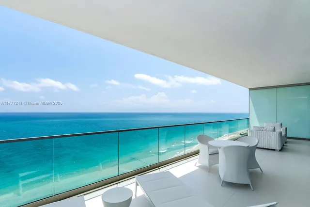 a view of a room with furniture and a potted plant