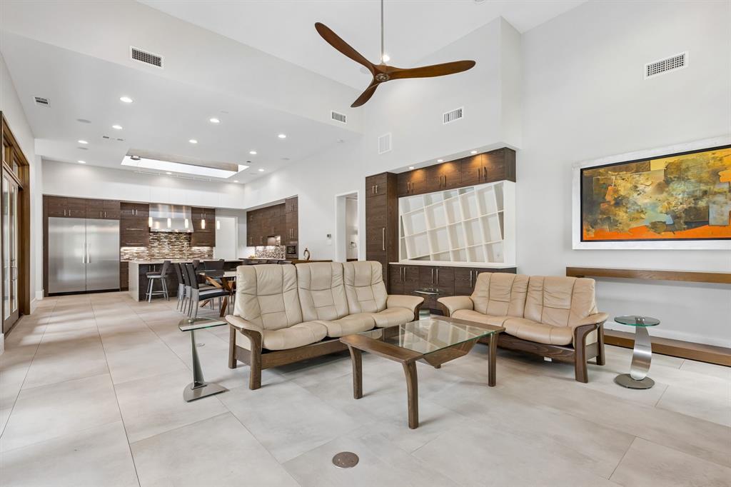 548 Oak Grove Lane Coppell, TX 75019 - Photo 14 of 36 a living room with furniture and a flat screen tv