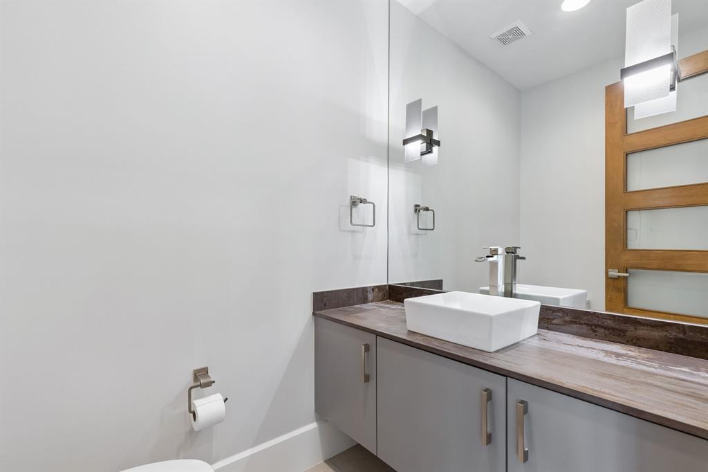548 Oak Grove Lane Coppell, TX 75019 - Photo 15 of 36 a bathroom with a sink and a mirror