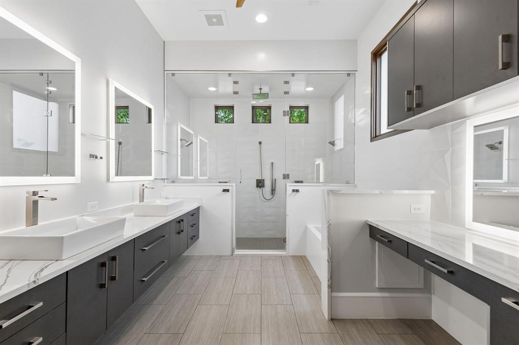 548 Oak Grove Lane Coppell, TX 75019 - Photo 20 of 36 a spacious bathroom with a double vanity sink and mirror