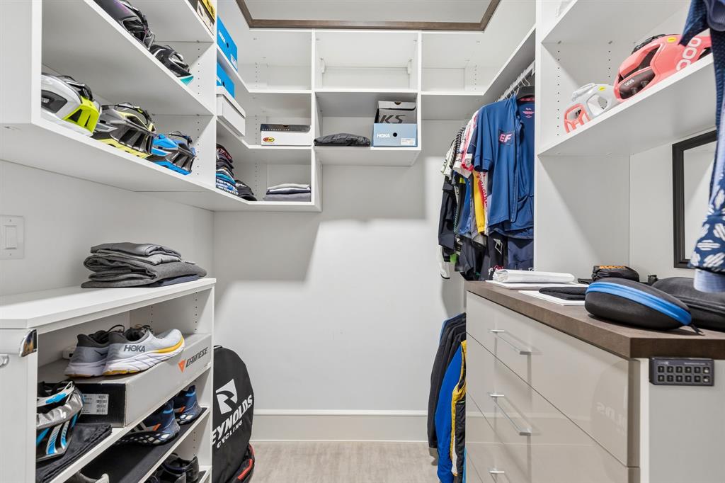 548 Oak Grove Lane Coppell, TX 75019 - Photo 23 of 36 a view of walk in closet with clothes and shoes