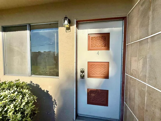 a view of a door and wooden floor