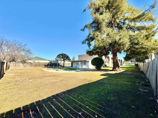 a view of a yard with an outdoor space