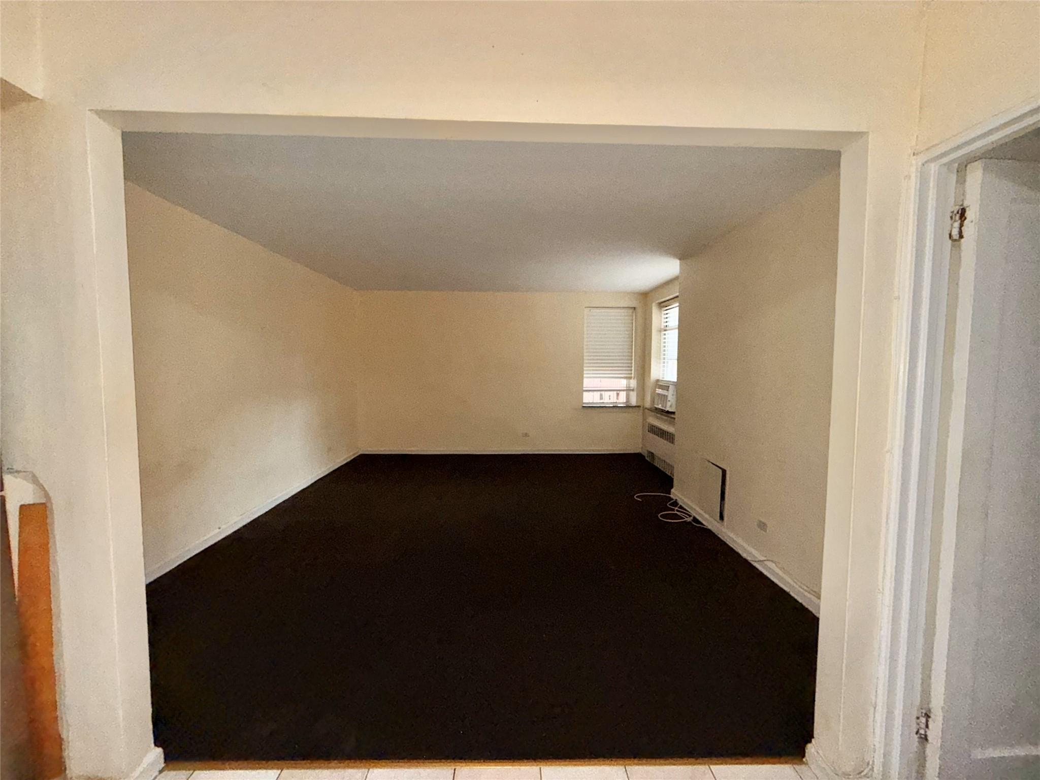 105-24 64th Road, Unit 4L Queens, NY 11375 - Photo 4 of 9 a view of hallway with wooden floor
